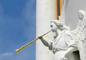 horning angel statuette